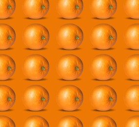 Image of Tasty fresh ripe oranges on orange background