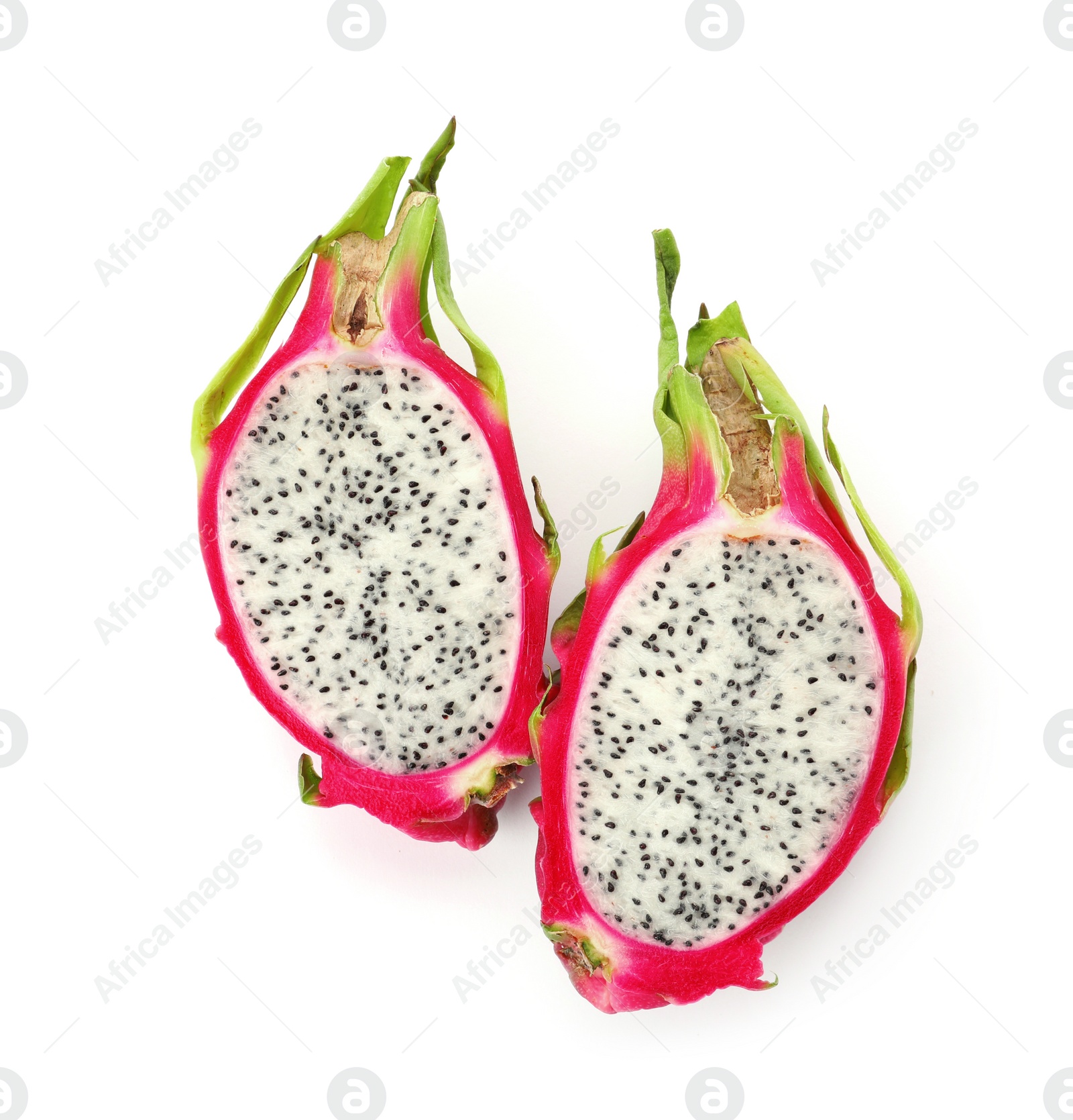 Photo of Halves of delicious dragon fruit (pitahaya) on white background, top view