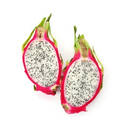 Photo of Halves of delicious dragon fruit (pitahaya) on white background, top view