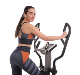 Photo of Woman using modern elliptical machine on white background