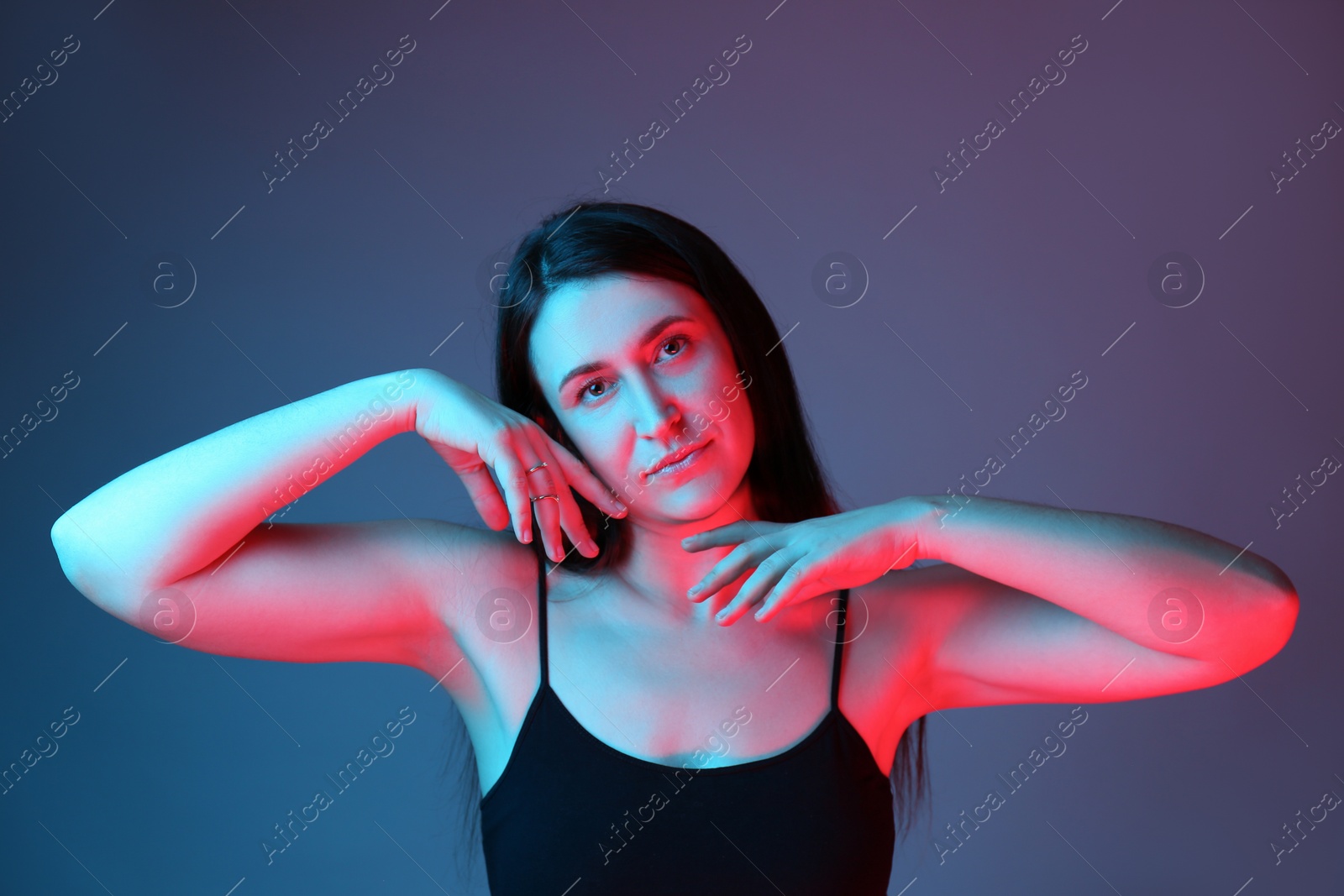 Photo of Portrait of beautiful young woman on color background