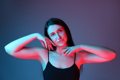 Photo of Portrait of beautiful young woman on color background