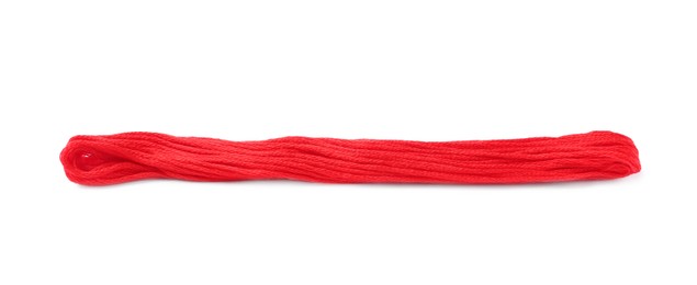 Photo of Bright red embroidery thread on white background