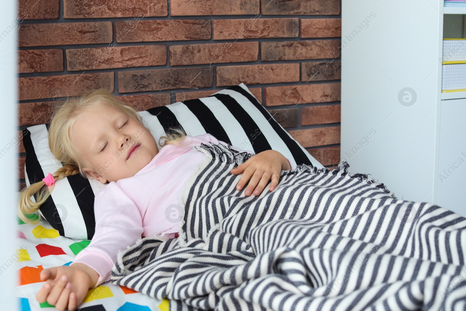 Photo of Cute little girl sleeping in bed at home
