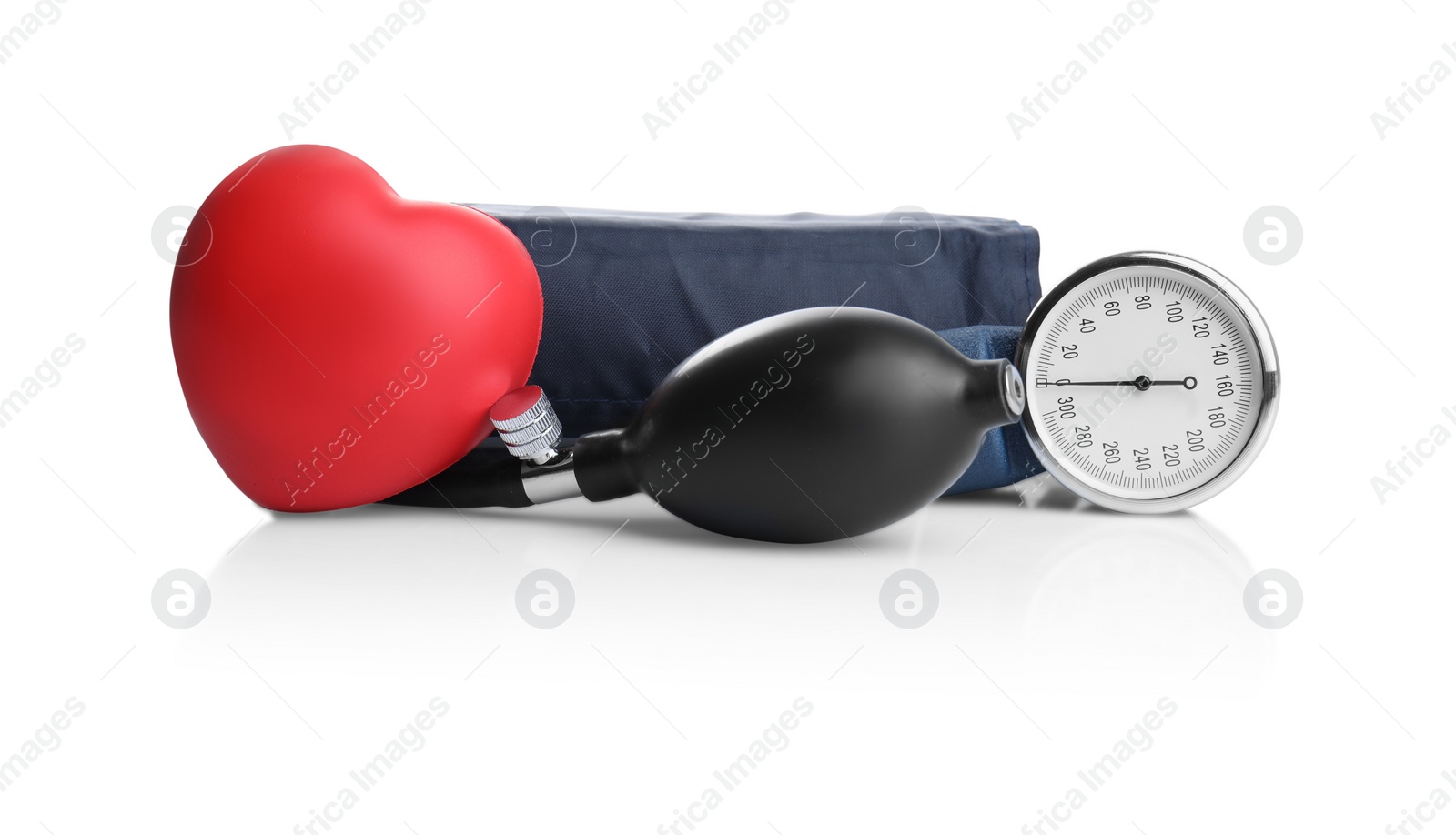 Photo of Blood pressure meter and toy heart on white background