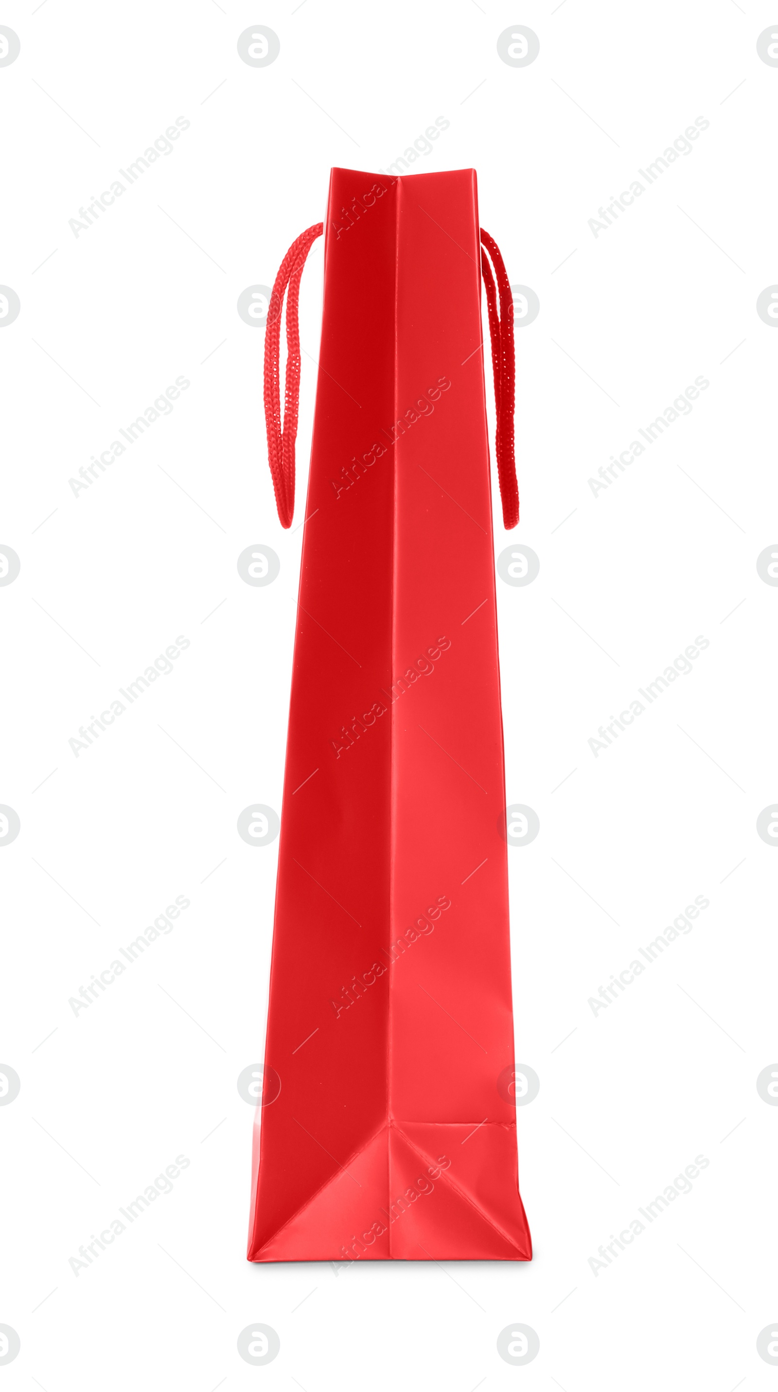 Photo of One red shopping bag isolated on white