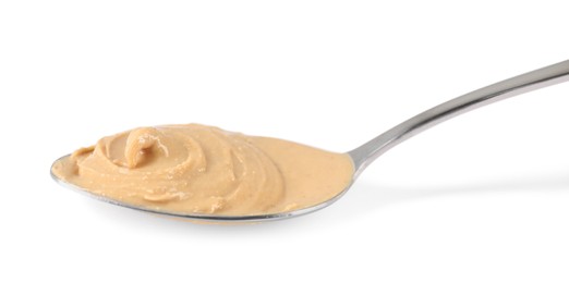 Delicious nut butter in spoon isolated on white