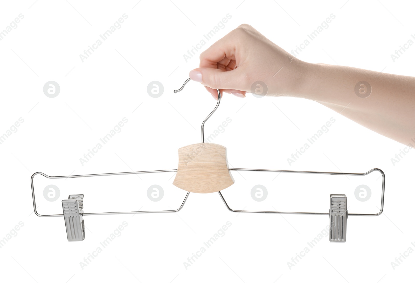 Photo of Woman holding hanger with clips on white background, closeup