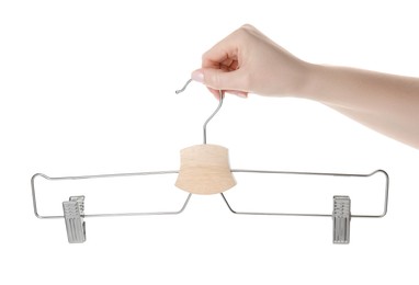 Photo of Woman holding hanger with clips on white background, closeup