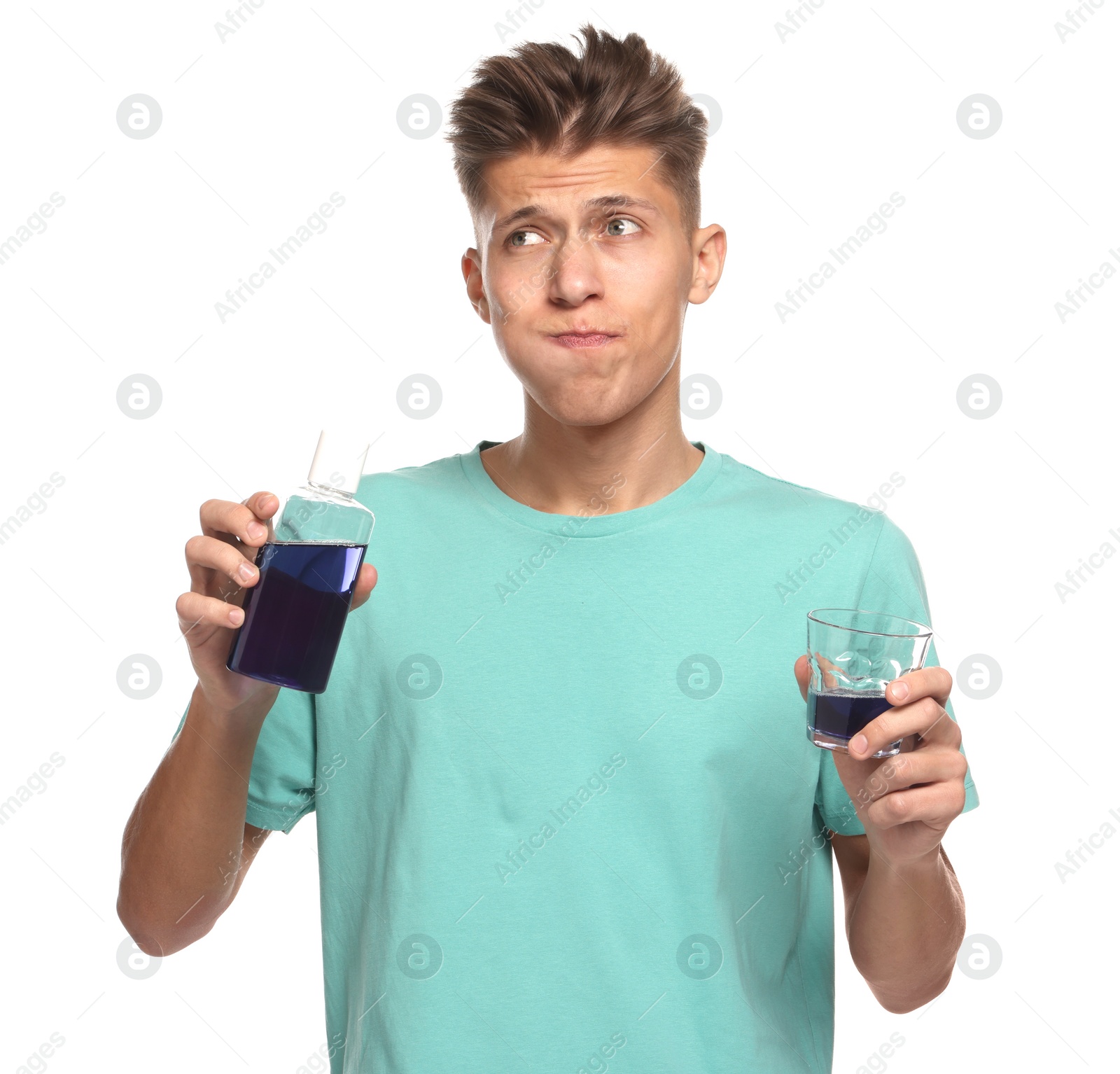 Photo of Young man using mouthwash on white background