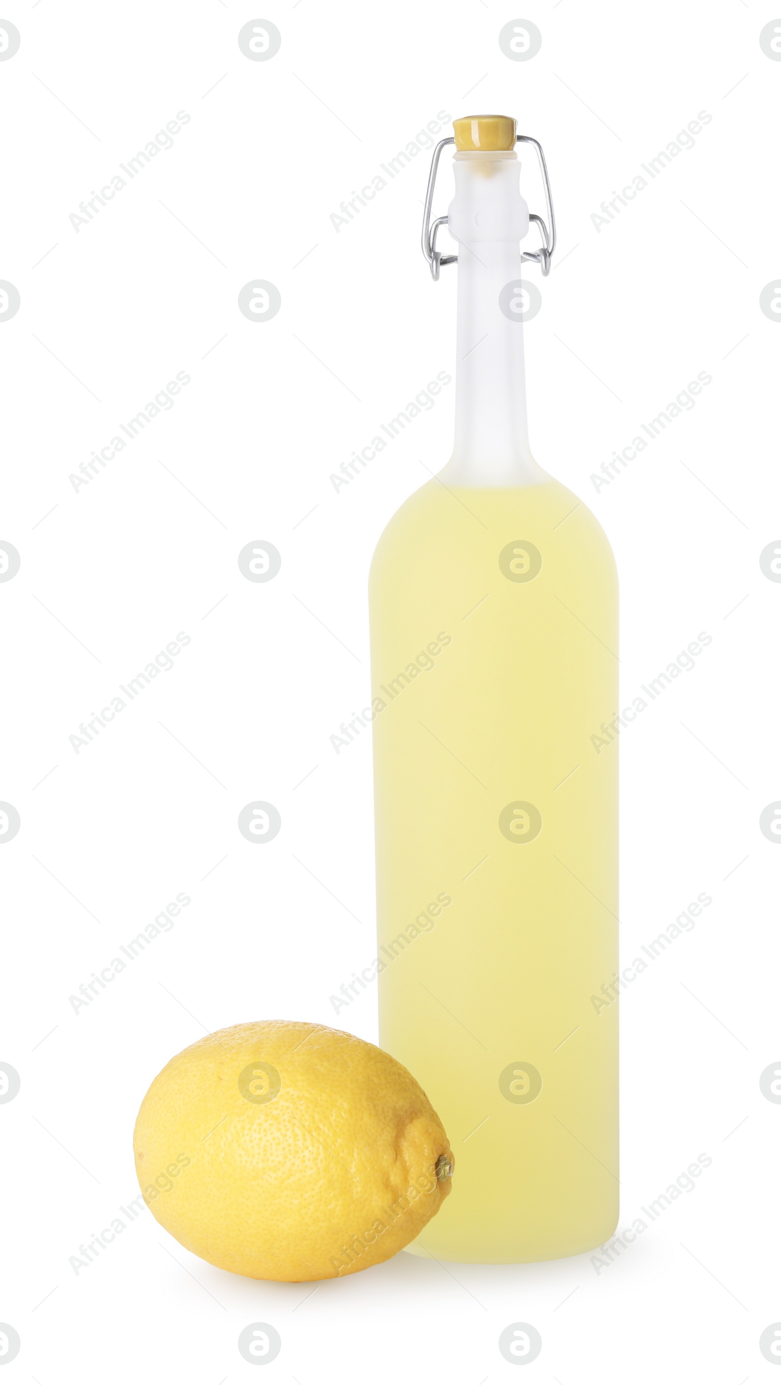 Photo of Bottle of tasty limoncello liqueur and lemon isolated on white