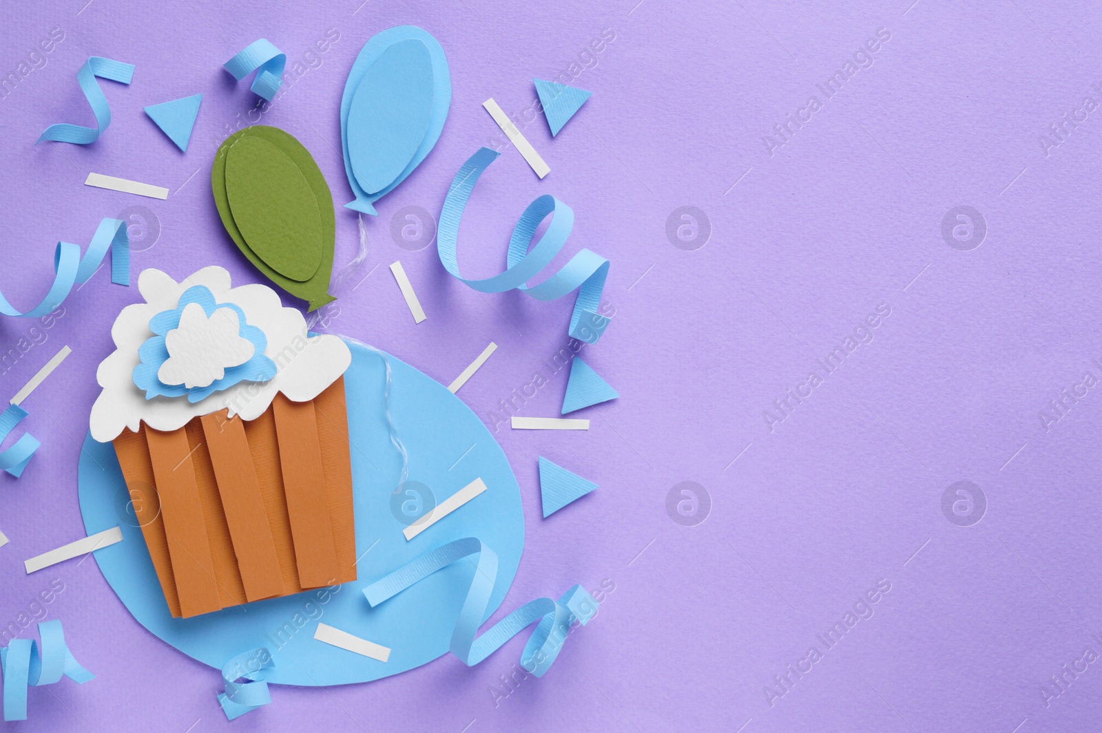 Photo of Birthday party. Paper cupcake and air balloons on lilac background, flat lay. Space for text
