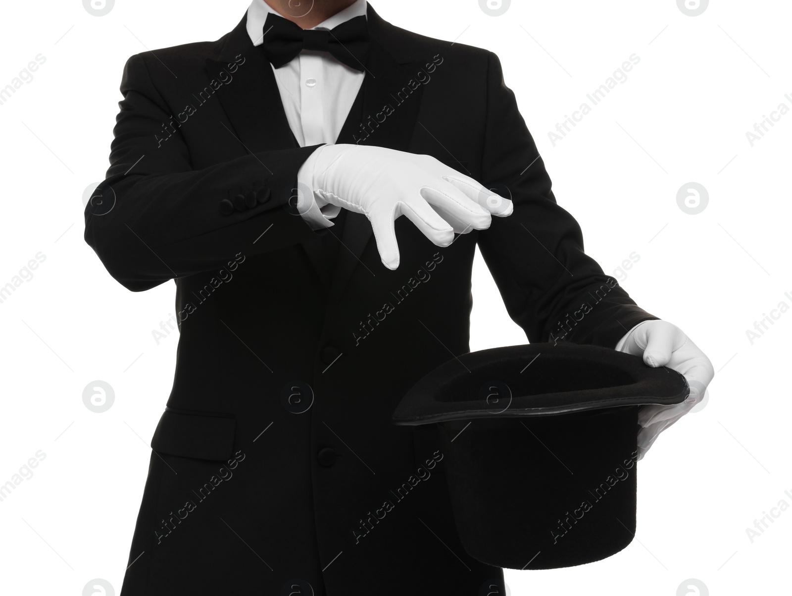 Photo of Magician showing magic trick with top hat on white background, closeup