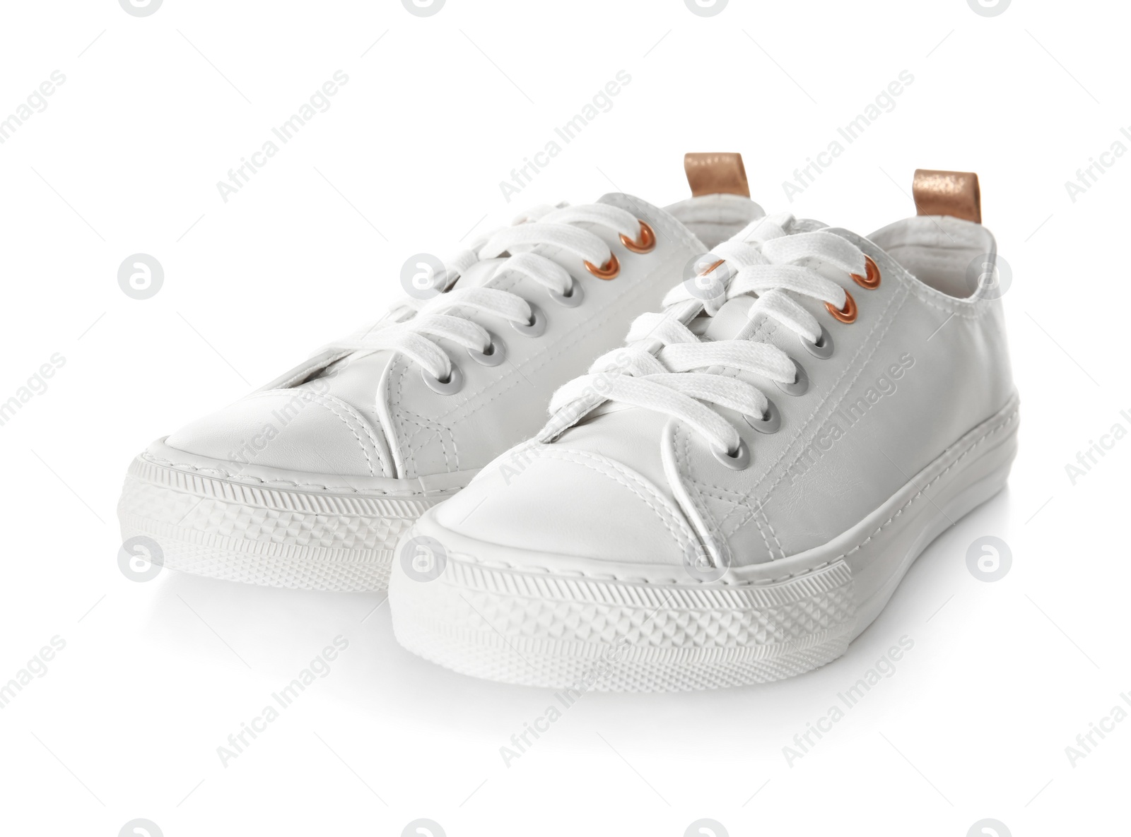 Photo of Pair of casual shoes on white background