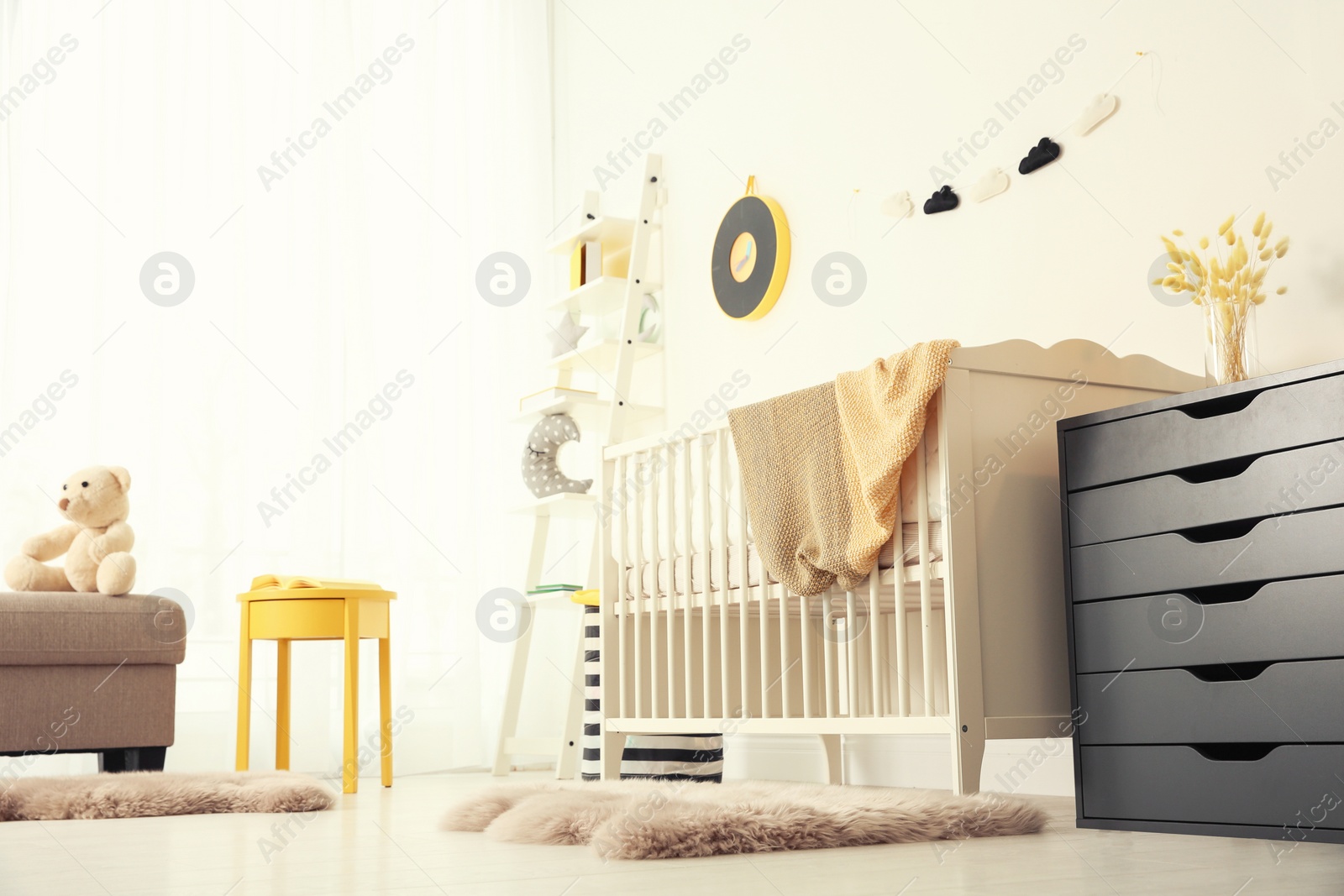 Photo of Stylish baby room interior with crib