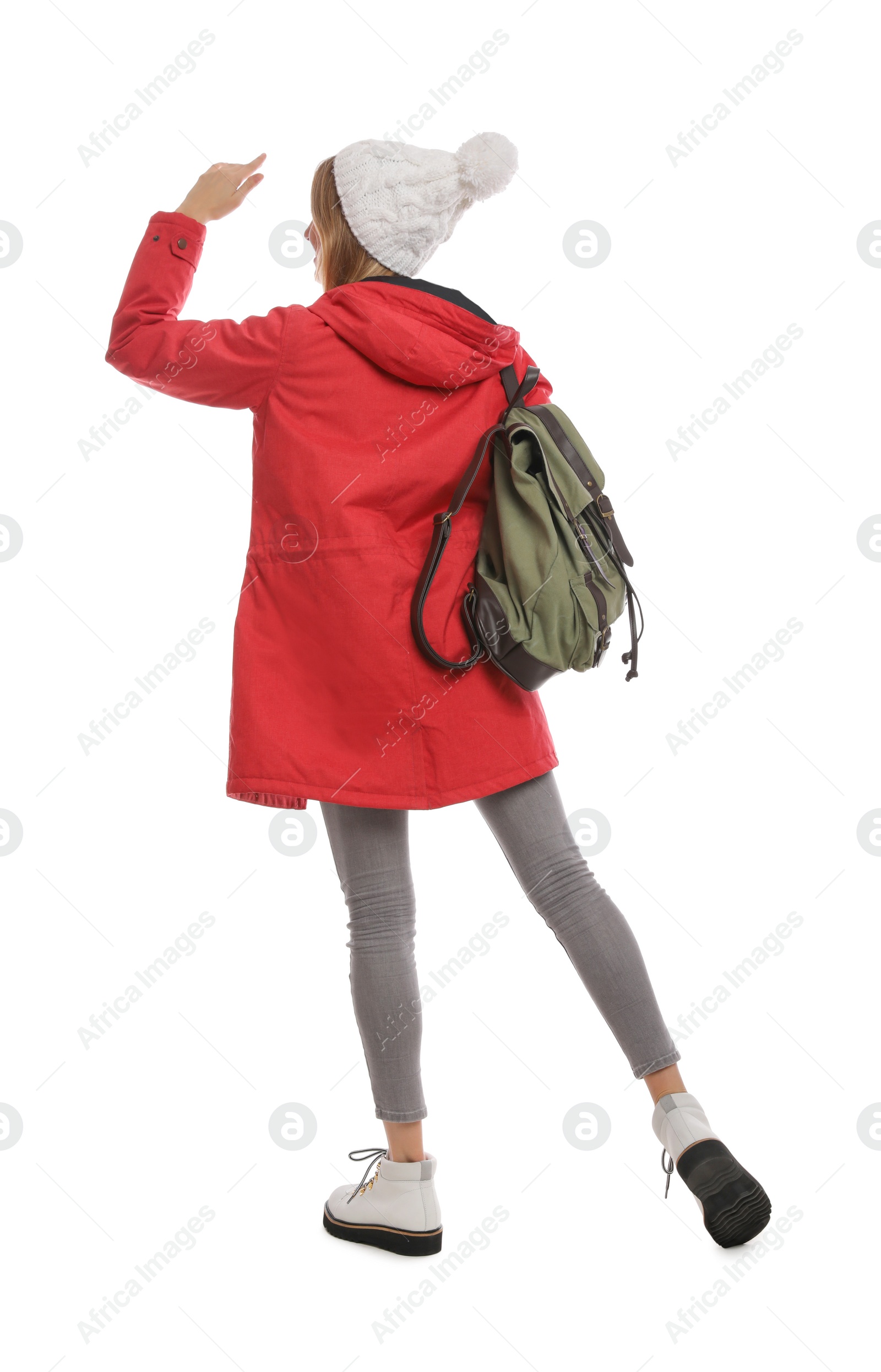 Photo of Woman with backpack on white background, back view. Winter travel