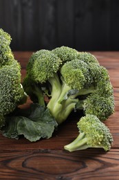 Fresh raw broccoli on wooden table, closeup