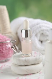 Photo of Composition with spa cosmetic on white wooden table, closeup