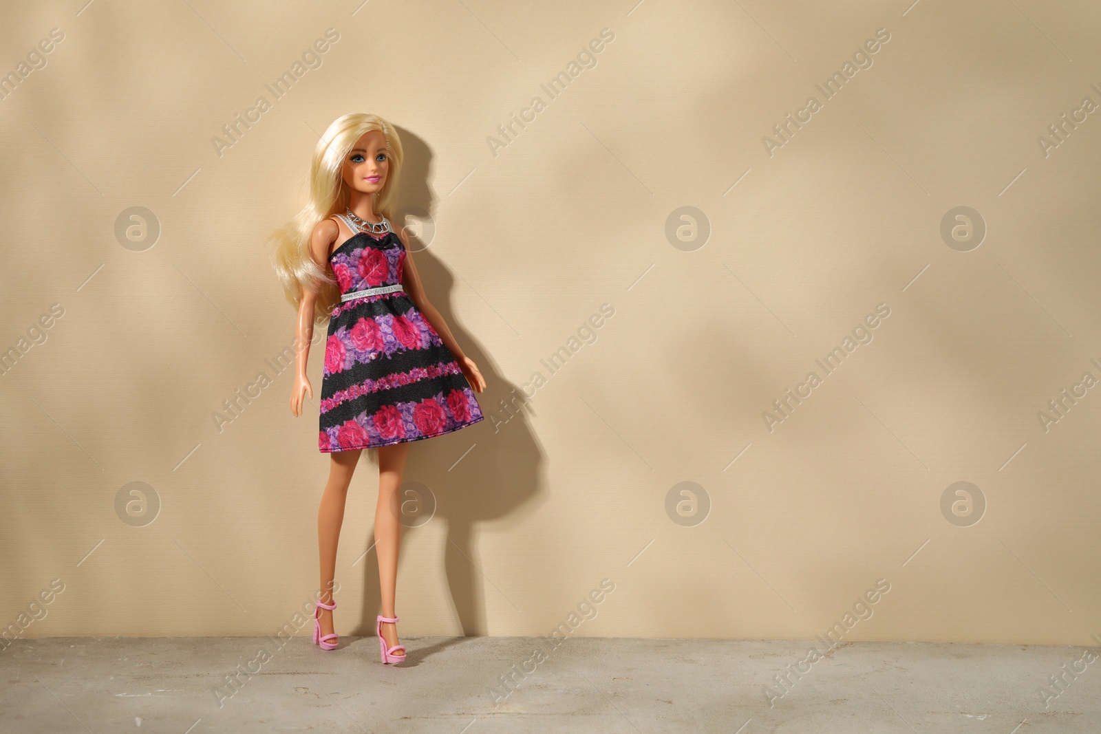 Photo of Mykolaiv, Ukraine - September 4, 2023: Beautiful Barbie doll on beige background, space for text