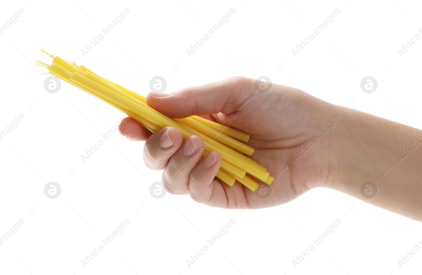 Photo of Woman holding church candles on white background, closeup