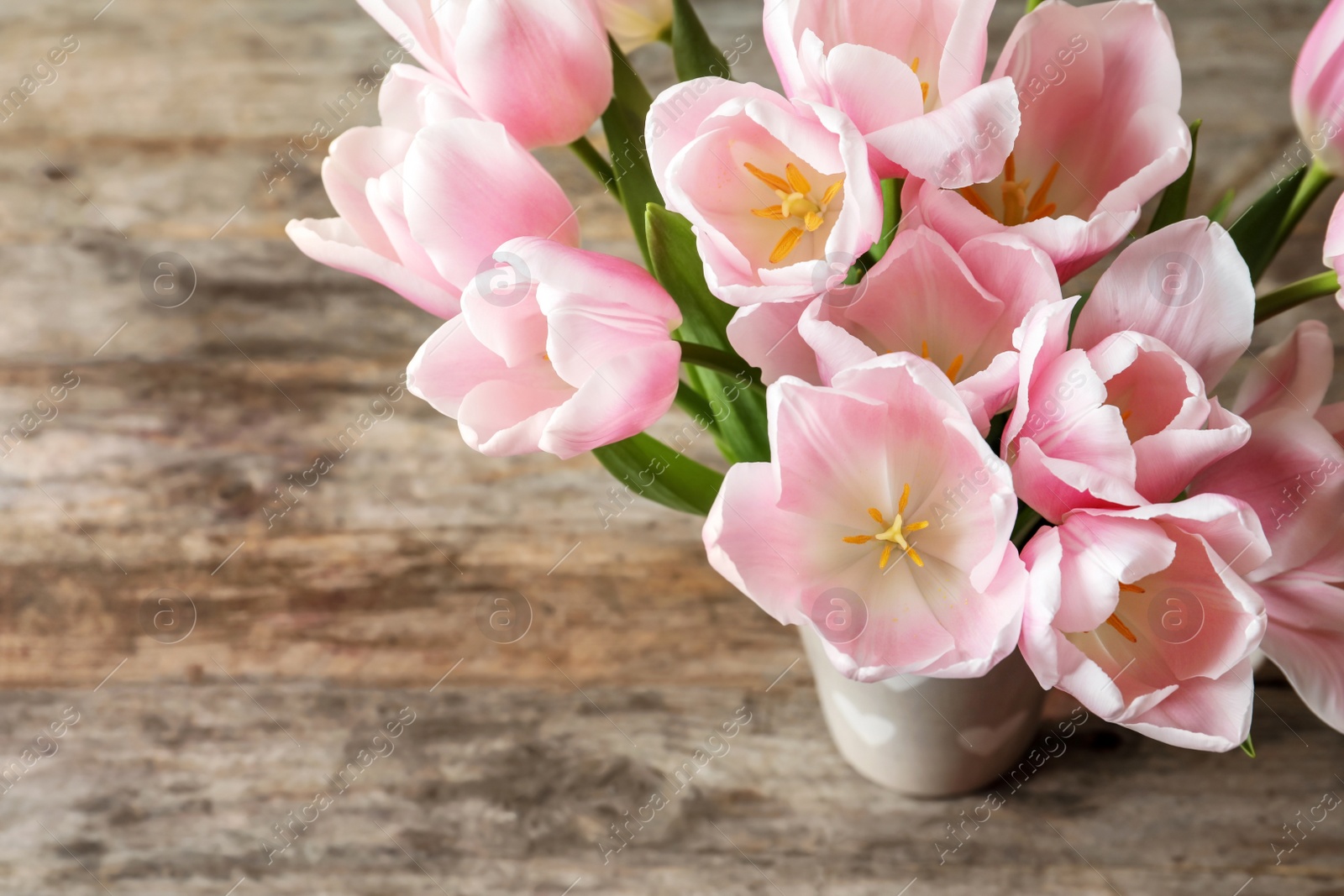 Photo of Beautiful tulips for Mother's Day on table, top view