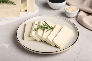 Photo of Delicious tofu with rosemary served on light table