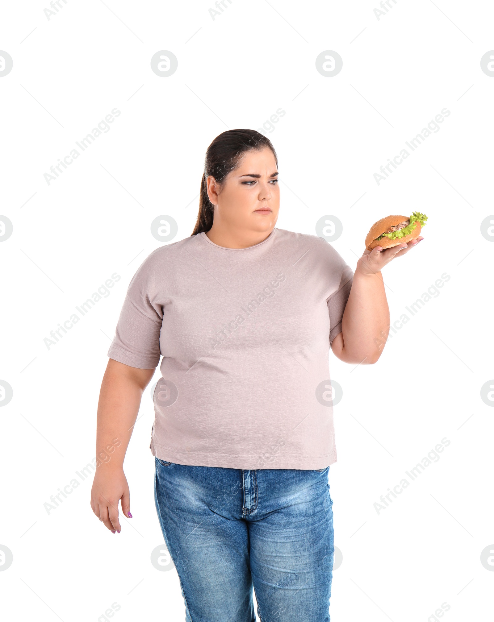 Photo of Overweight woman with hamburger on white background