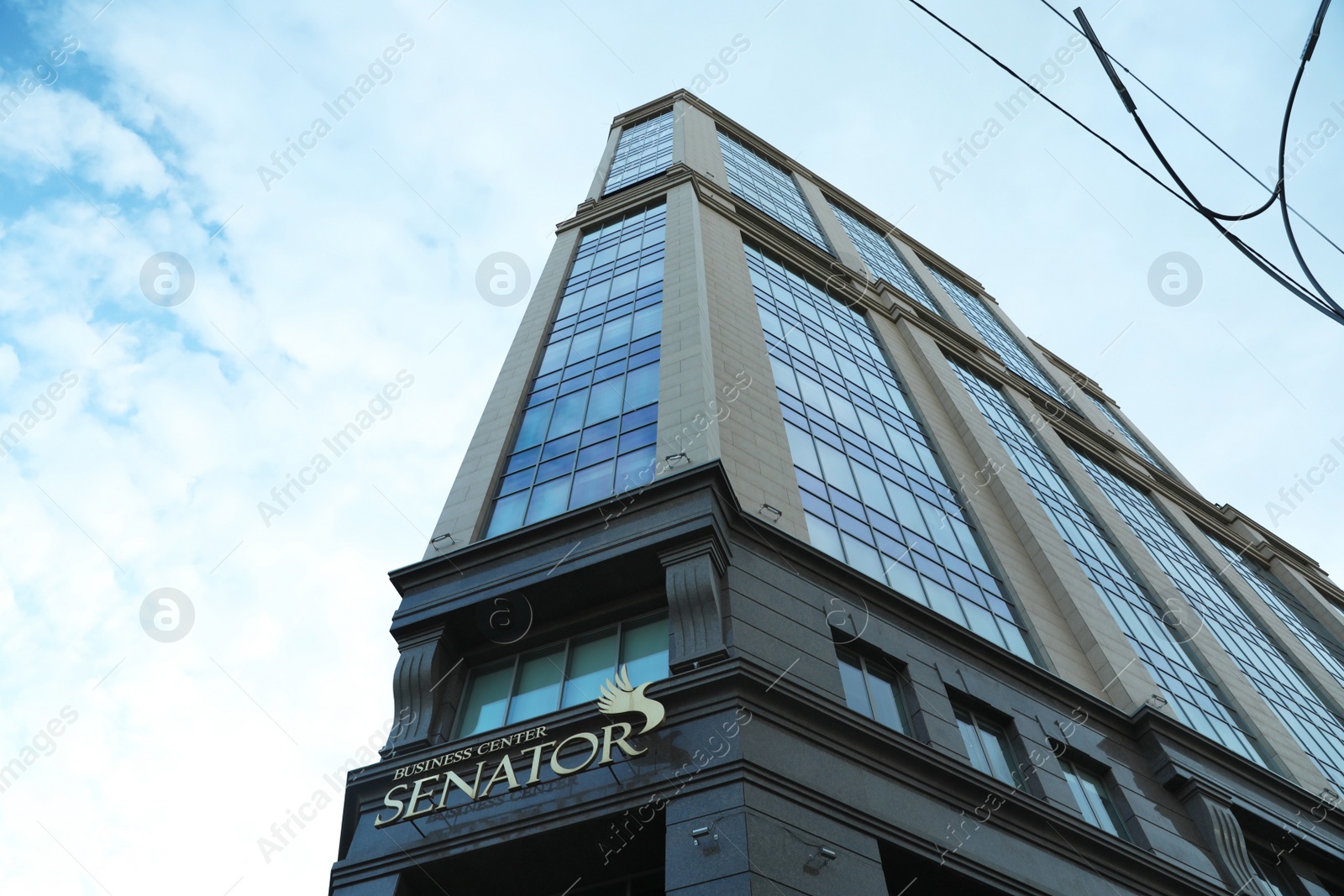 Photo of KYIV, UKRAINE - MAY 23, 2019: Modern business center SENATOR against sky with clouds