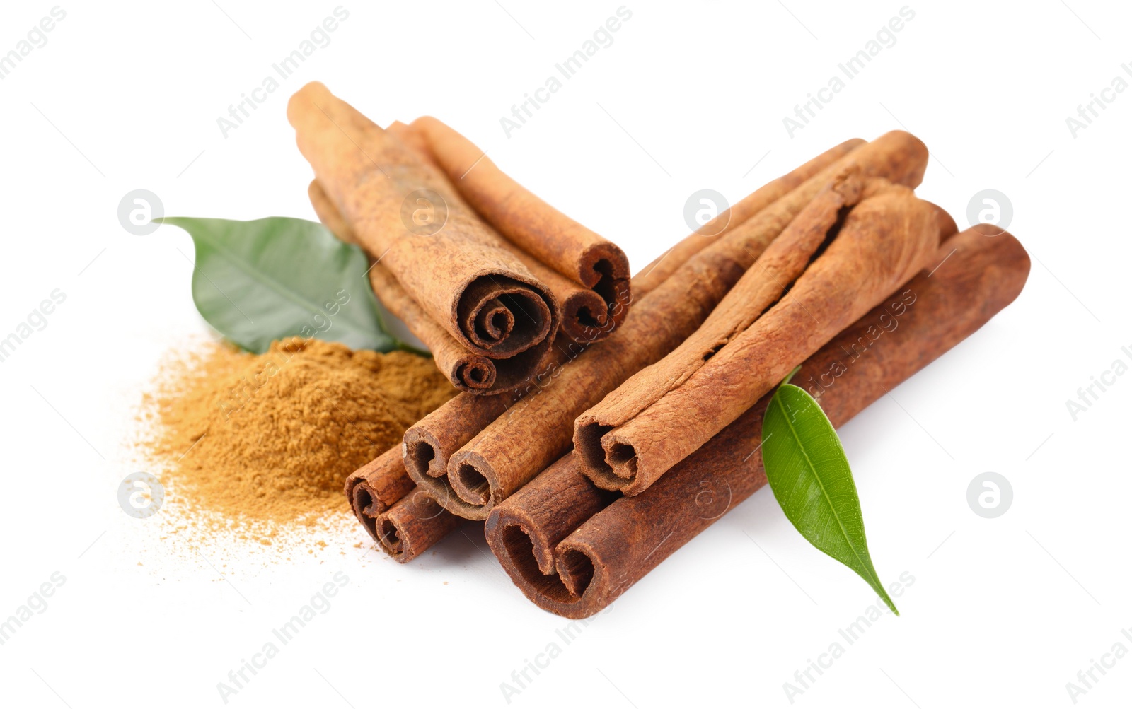 Photo of Dry aromatic cinnamon sticks, powder and green leaves isolated on white