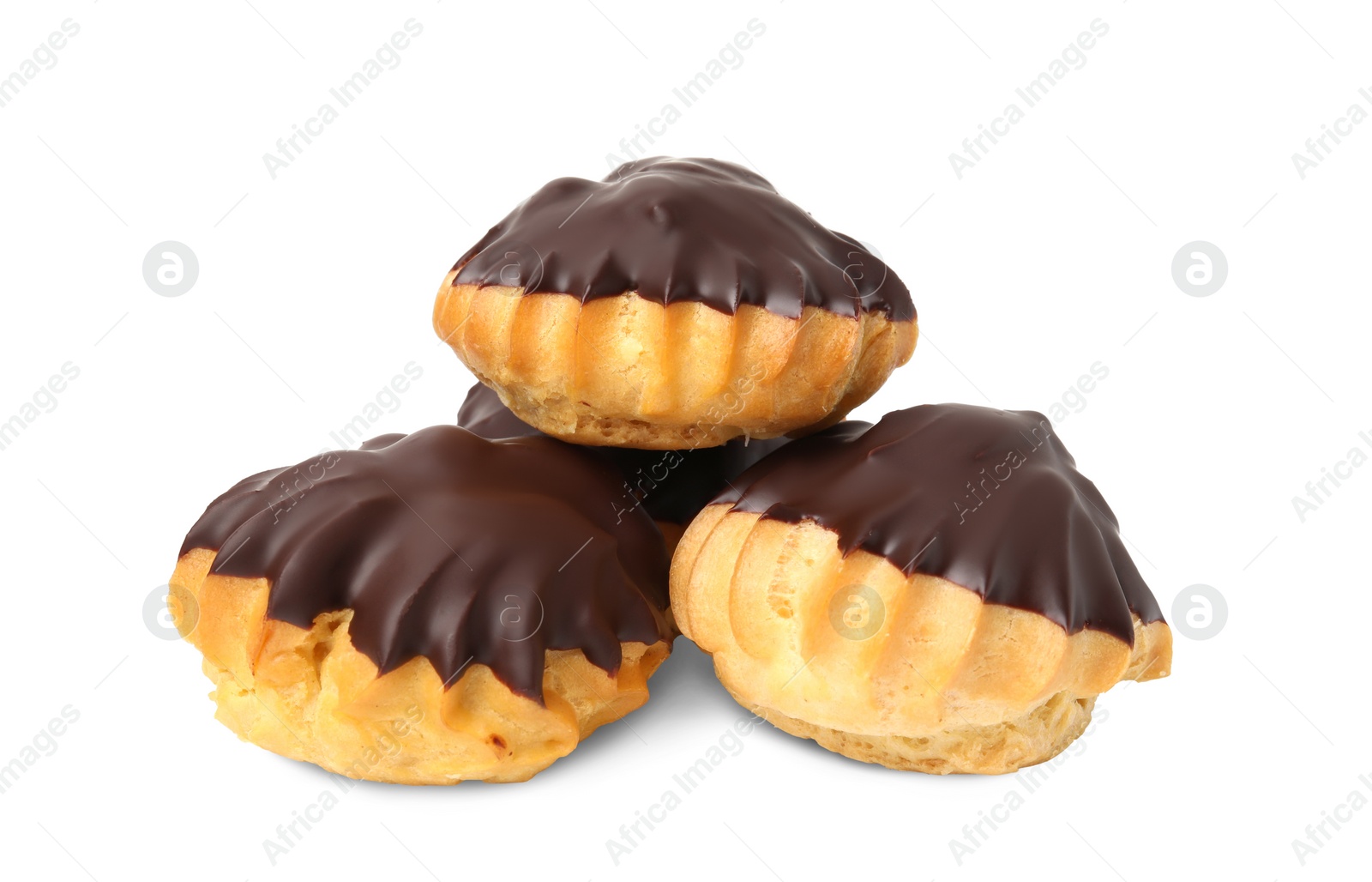 Photo of Delicious profiteroles with chocolate spread isolated on white