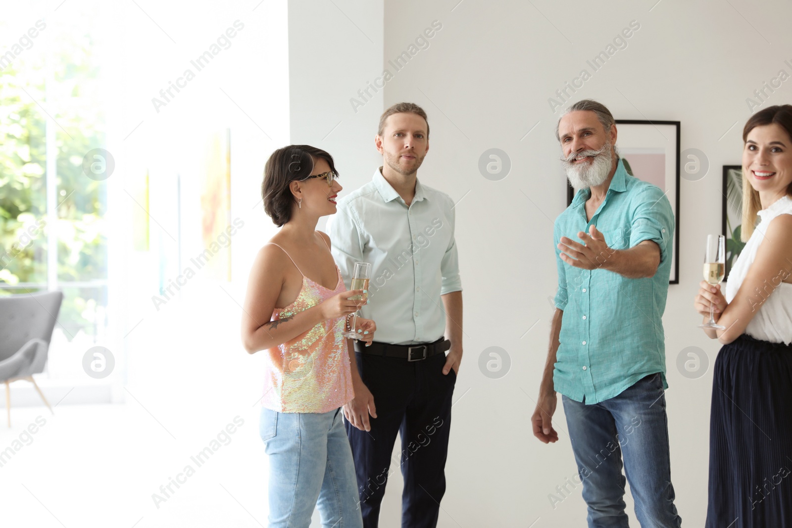 Photo of Group of people at exhibition in art gallery