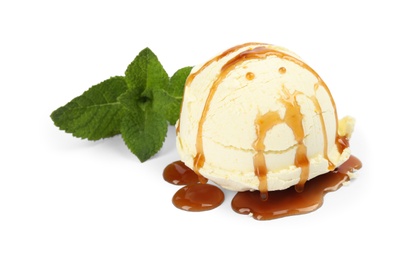 Photo of Delicious ice cream with mint and caramel sauce on white background