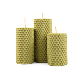 Photo of Stylish elegant beeswax candles isolated on white