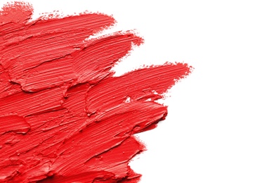 Photo of Strokes of lipstick on white background, top view