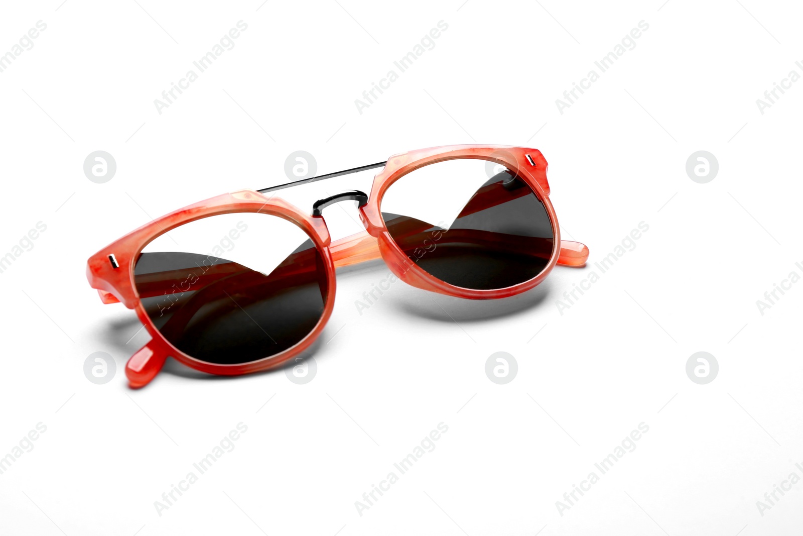 Photo of Stylish sunglasses on white background. Fashionable accessory