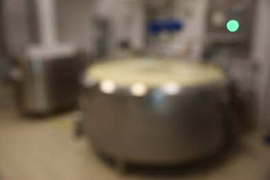 Photo of Blurred view of curd preparation tank at cheese factory