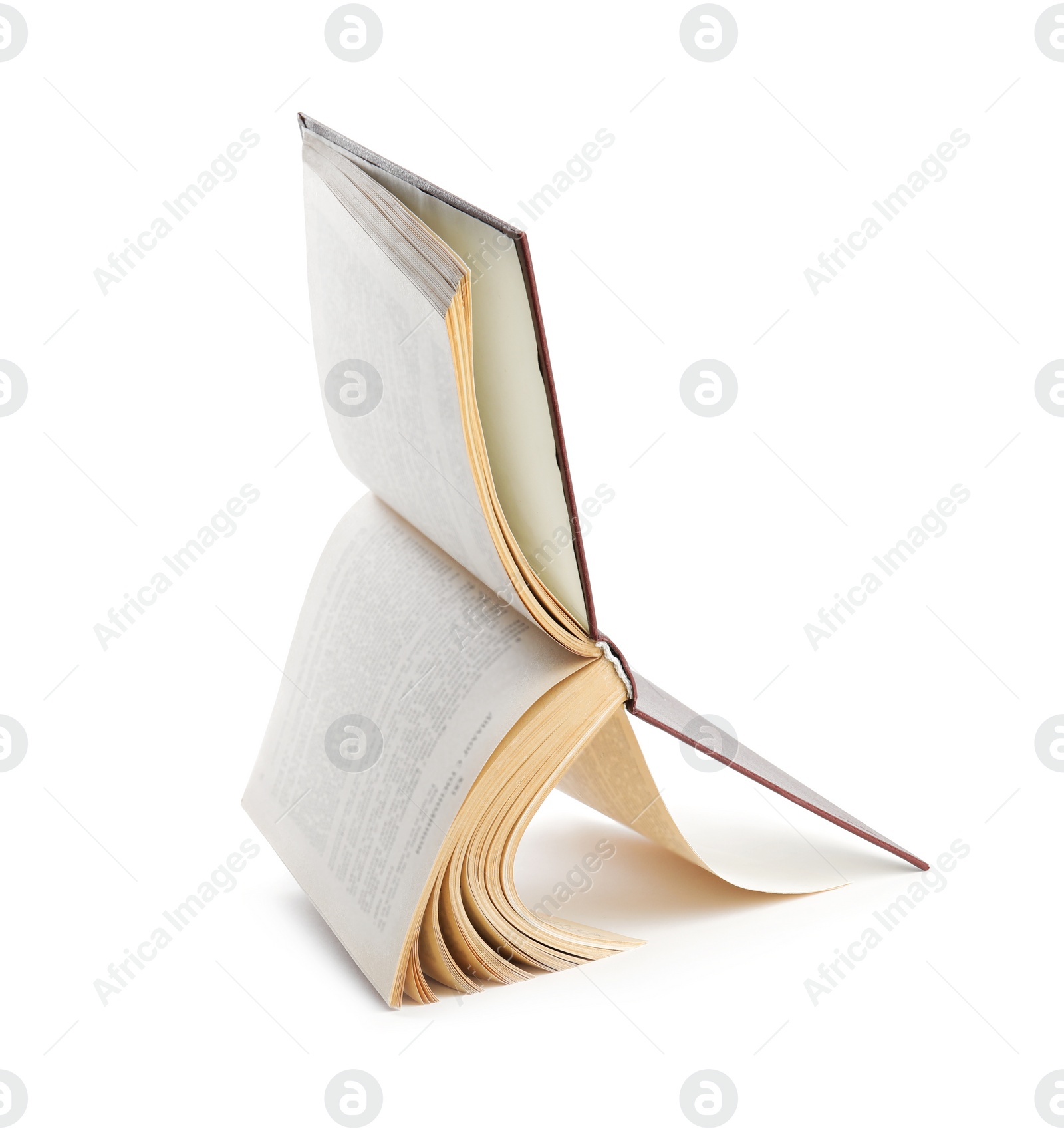 Photo of Open old hardcover book isolated on white