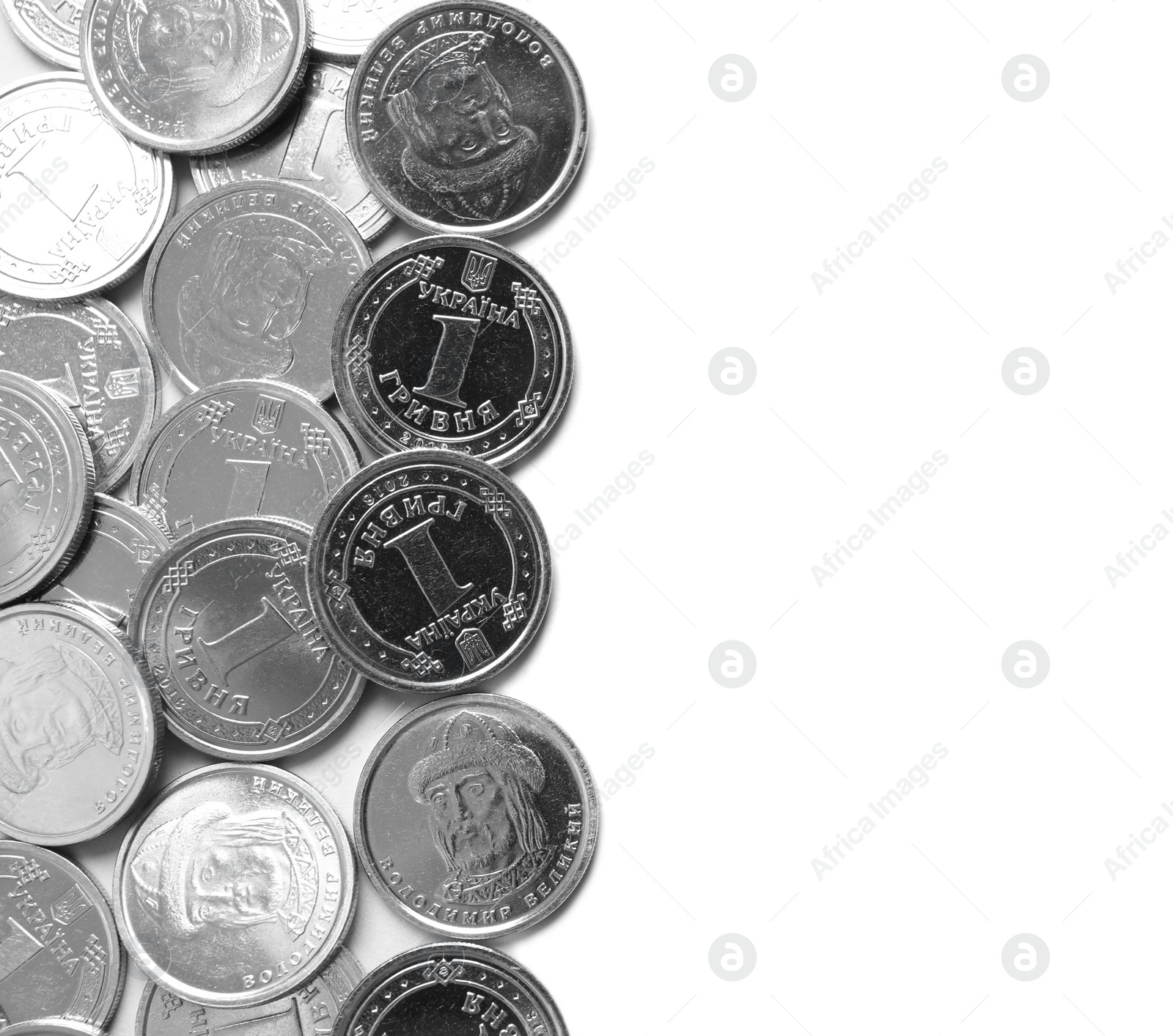 Photo of Many Ukrainian coins on white background, top view. National currency
