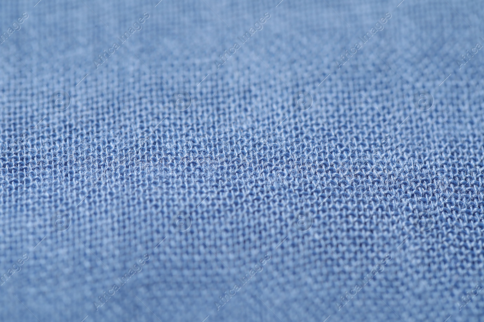Photo of Texture of soft blue fabric as background, closeup