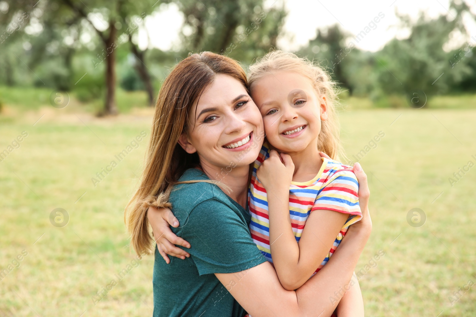 Photo of Woman with her child outdoors. Happy family