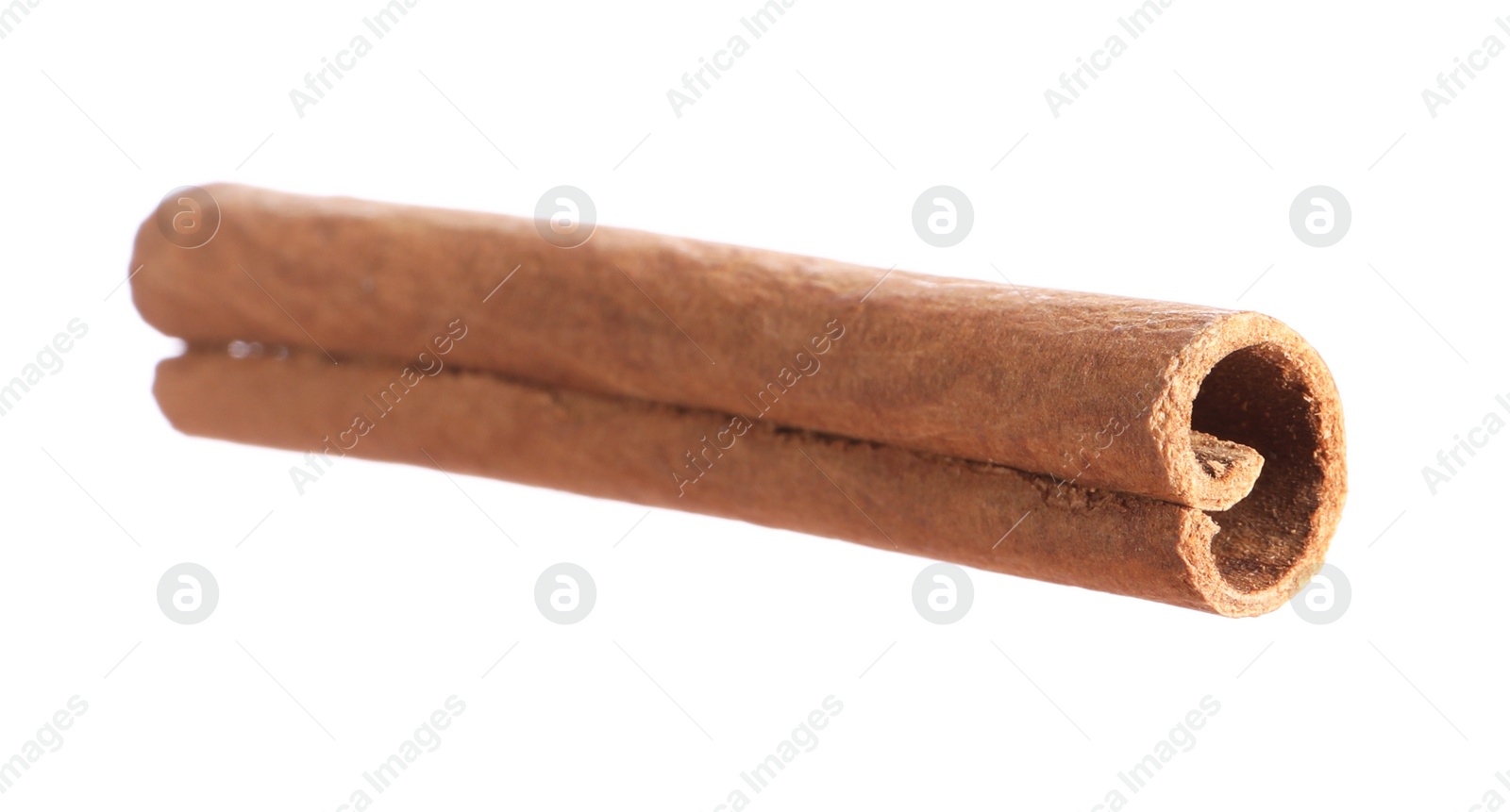 Photo of One aromatic cinnamon stick isolated on white