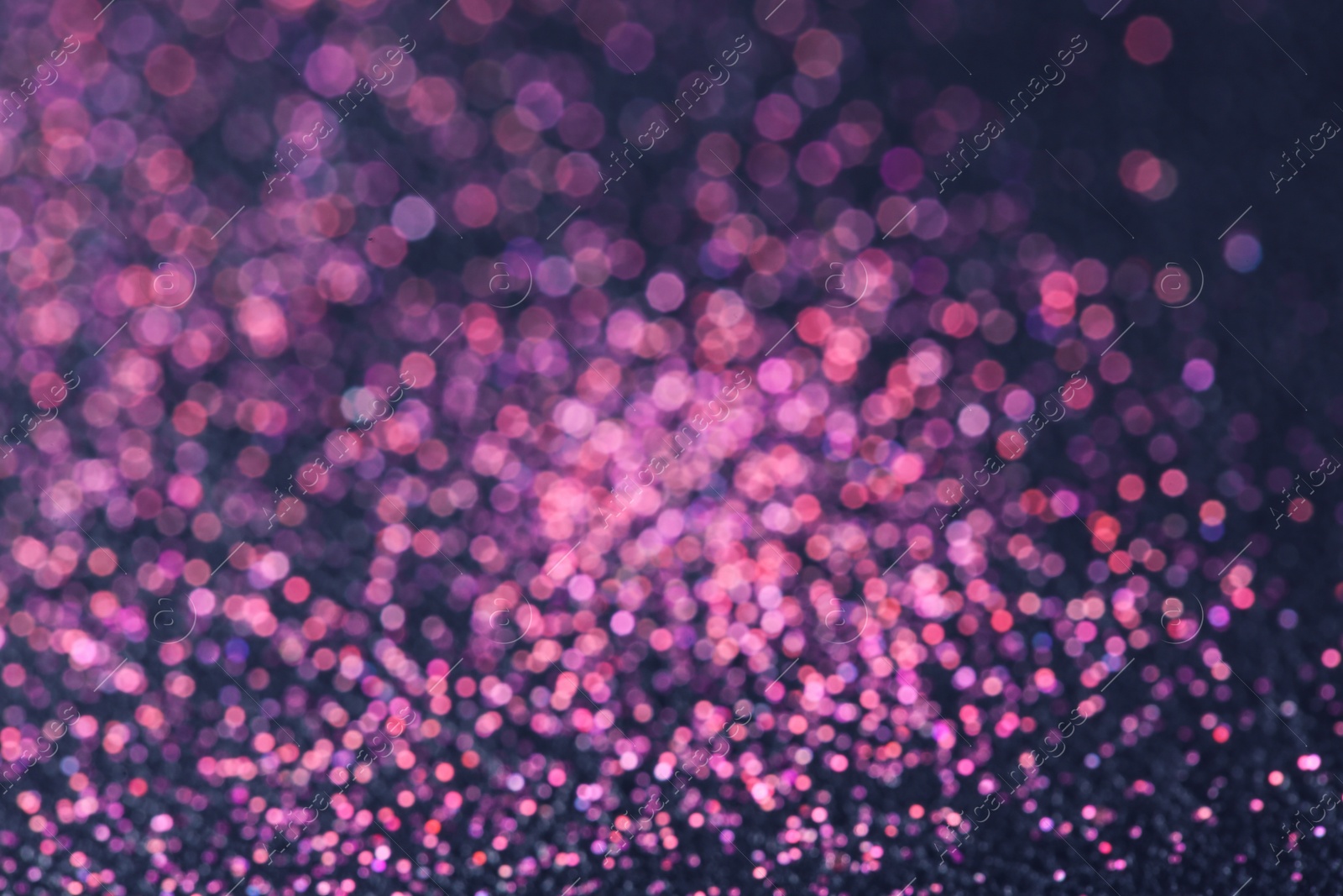 Photo of Magic pink bokeh effect on dark background