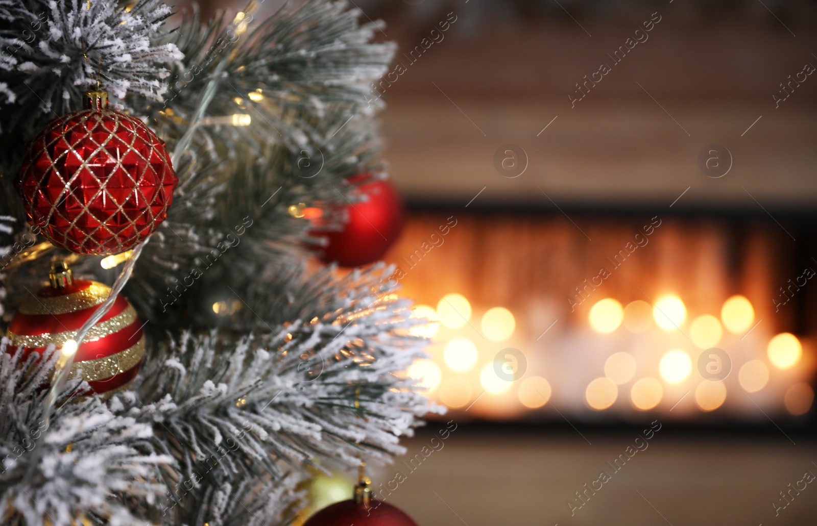 Photo of Closeup view of decorated Christmas tree in room, space for text. Festive interior