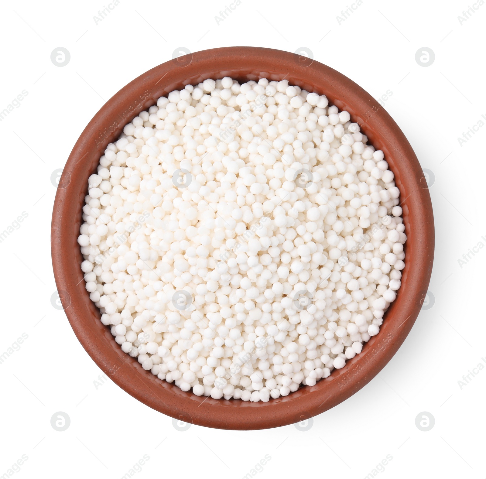 Photo of Tapioca pearls in bowl isolated on white, top view