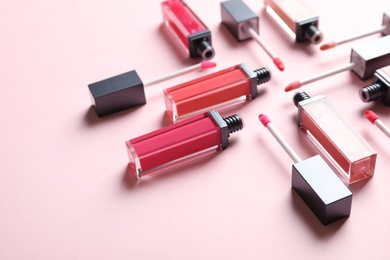 Composition of liquid lipsticks on color background