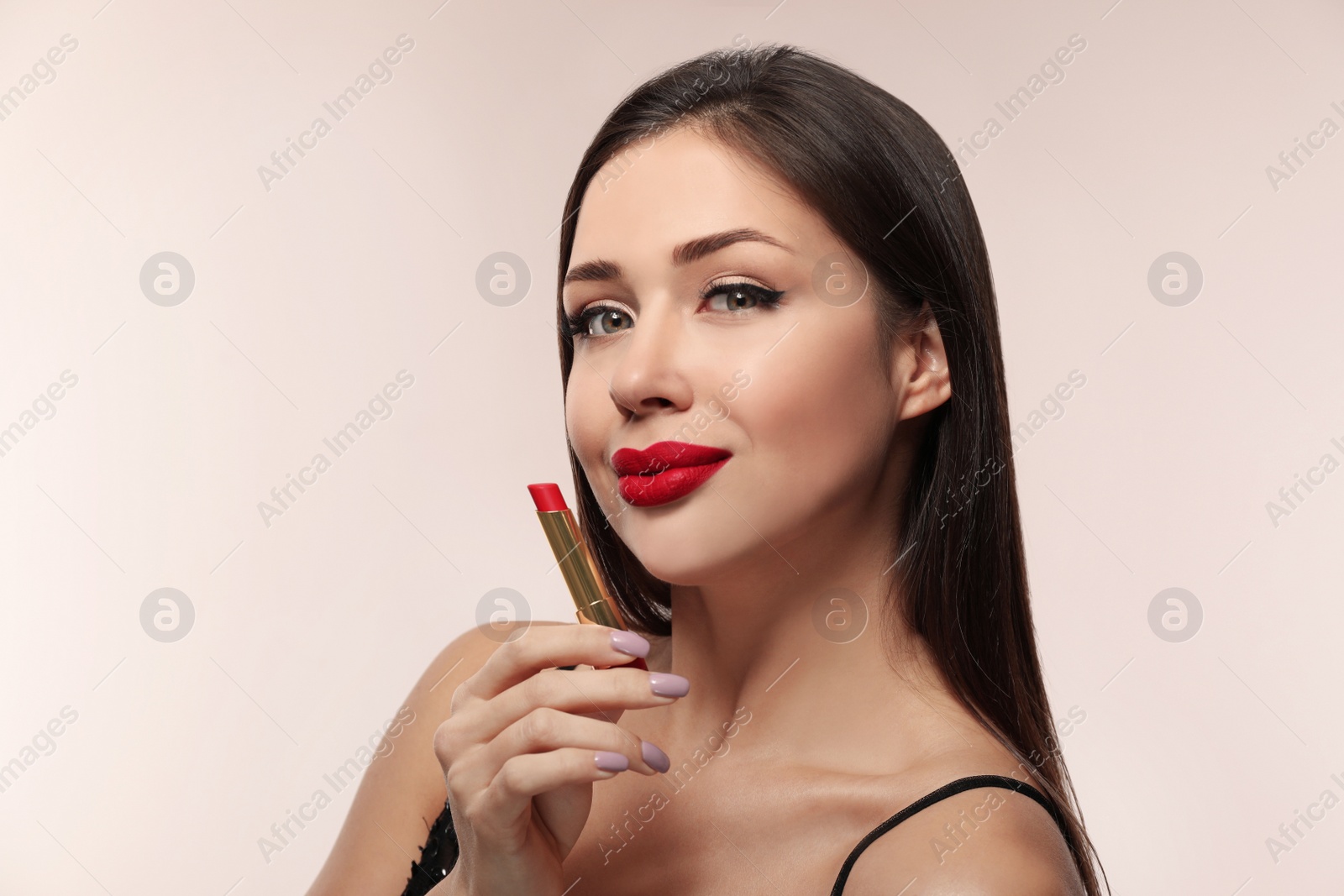 Photo of Beautiful woman with red lipstick on light background