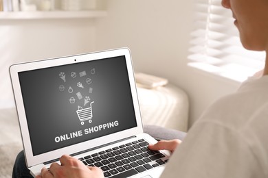 Image of Man using laptop for online shopping indoors, closeup