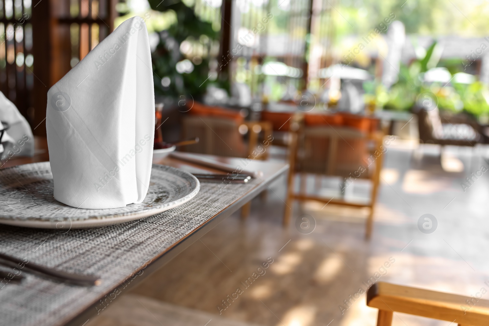 Photo of Dishware and cutlery on table in cafeteria, closeup. Breakfast, lunch or dinner time