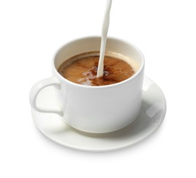 Pouring milk into cup of coffee on white background