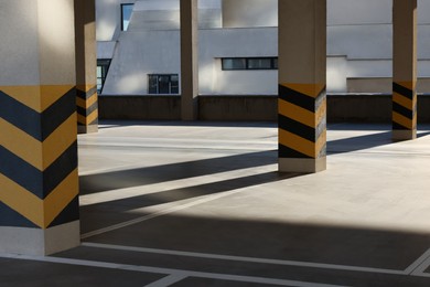 Photo of Empty open car parking garage on sunny day